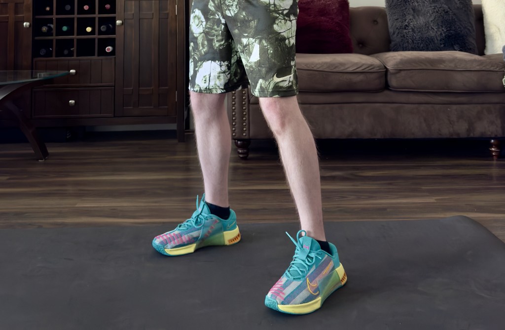 Nike Metcon 9 gym shoes on a black mat